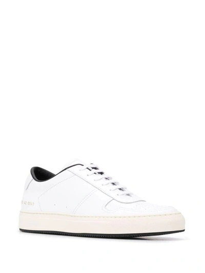 Shop Common Projects Low Top Sneakers In White