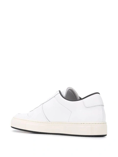 Shop Common Projects Low Top Sneakers In White