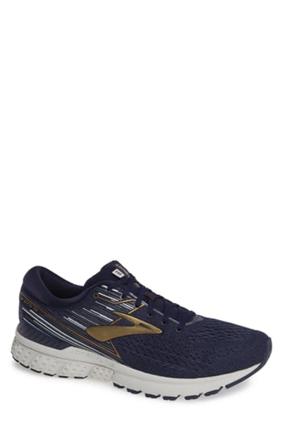 Shop Brooks Adrenaline Gts 19 Running Sneaker In Navy/gold/grey