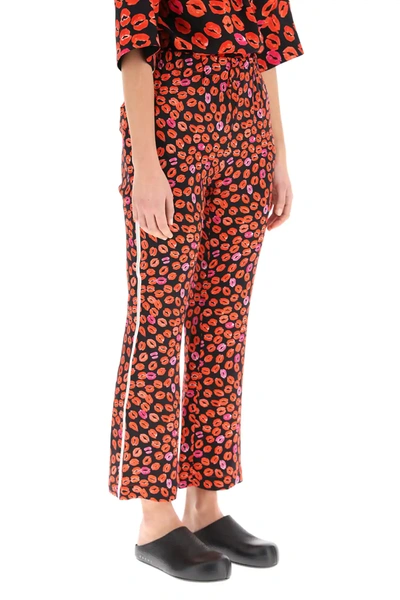 Shop Marni Kiss Print Pajama Trousers In Red,black