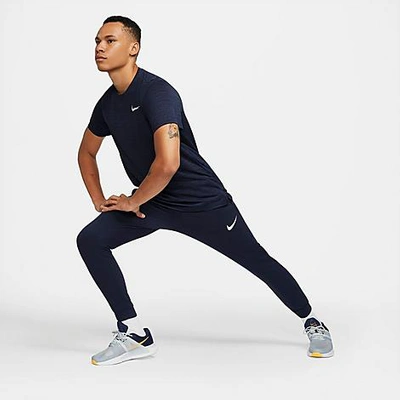 Shop Nike Men's Dri-fit Tapered Training Pants In Obsidian/white