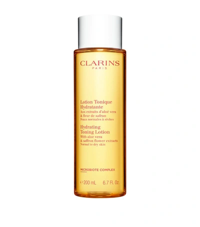 Shop Clarins Hydrating Toning Lotion (200ml) In White