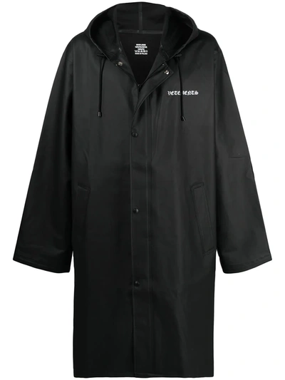 Shop Vetements Logo Print Long Raincoat In Black