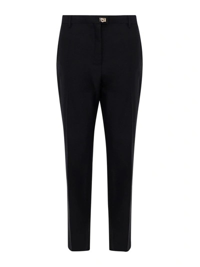 Shop Ferragamo Virgin Wool Carrot Fit Trousers In Black