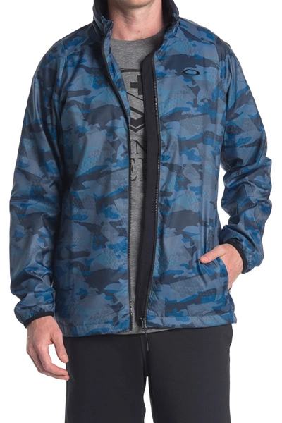Shop Oakley Enhance Graphic Wind Warm Jacket In Blue Storm Print