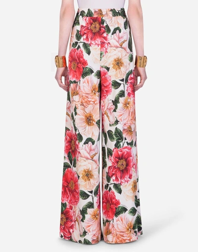 Shop Dolce & Gabbana Flared Camellia-print Cady Pants