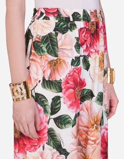 Shop Dolce & Gabbana Flared Camellia-print Cady Pants