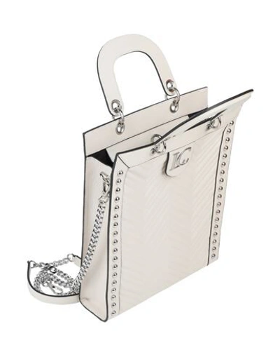 Shop La Carrie Handbags In White