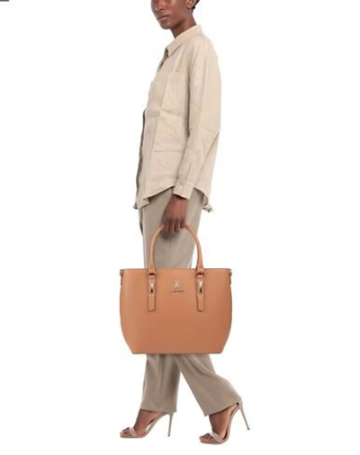 Shop Roberto Cavalli Handbags In Tan
