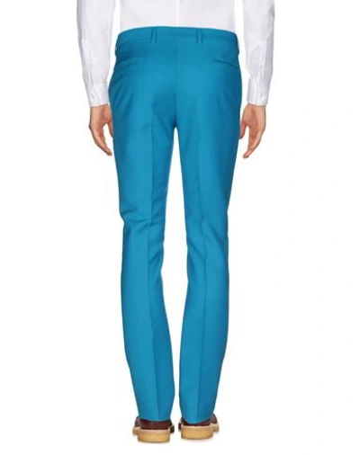Shop Versace Pants In Turquoise
