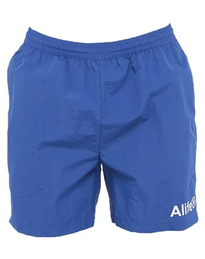 Shop Alife Swim Trunks In Blue