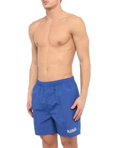 Shop Alife Swim Trunks In Blue