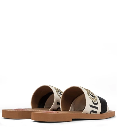 Shop Chloé Woody Embroidered Canvas Slides In White