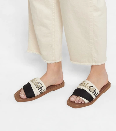 Shop Chloé Woody Embroidered Canvas Slides In White