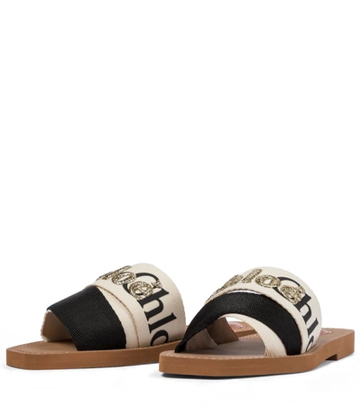 Shop Chloé Woody Embroidered Canvas Slides In White