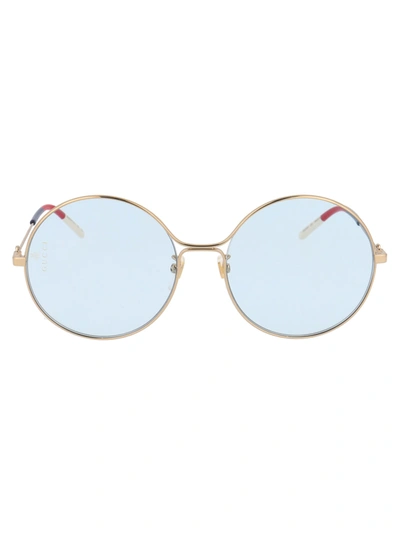Shop Gucci Gg0395s Sunglasses In 006 Gold Gold Light Blue