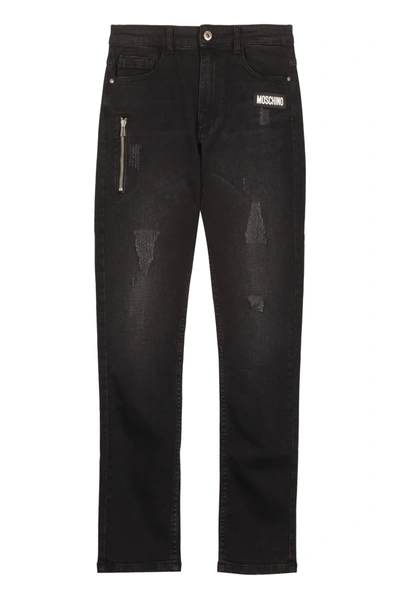 Shop Moschino Washed Out Denim Jeans In Black