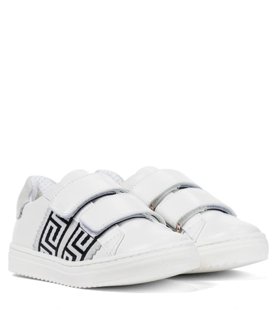 Shop Versace Logo Leather Sneakers In White