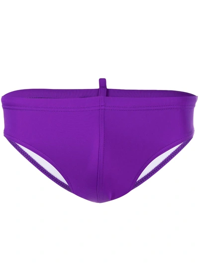 Shop Dsquared2 Rear Logo Swimming Trunks In Purple