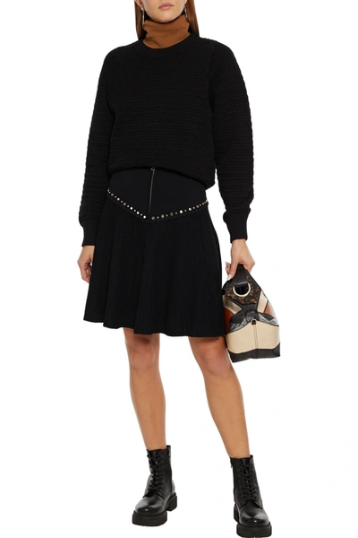 Shop Sandro Oria Paneled Embellished Ribbed-knit Mini Skirt In Black