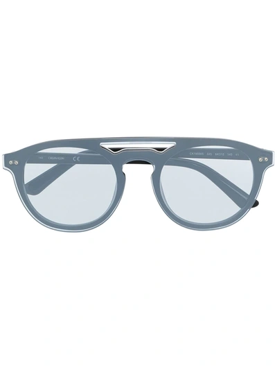 Shop Calvin Klein Round-frame Sunglasses In Silber
