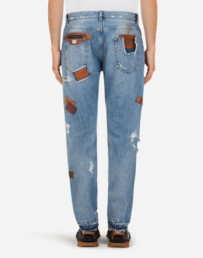 Shop Dolce & Gabbana Loose Jeans With Rips And Multiple Patches