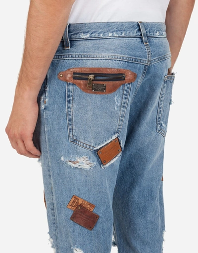 Shop Dolce & Gabbana Loose Jeans With Rips And Multiple Patches