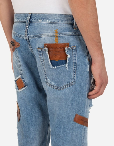 Shop Dolce & Gabbana Loose Jeans With Rips And Multiple Patches