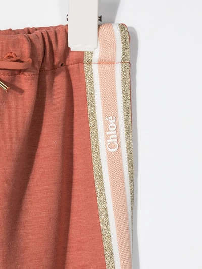 Shop Chloé Glitter Logo Stripe Trousers In Pink