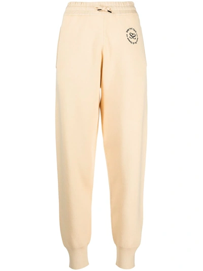 Shop Sandro Embroidered-logo Track Pants In Yellow