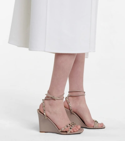 Shop Valentino Rockstud Leather Wedge Sandals In Pink