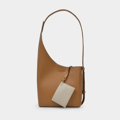 Shop Aesther Ekme Demi Lune Bag In Brown