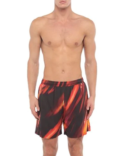 Shop Aries Swim Trunks In Red