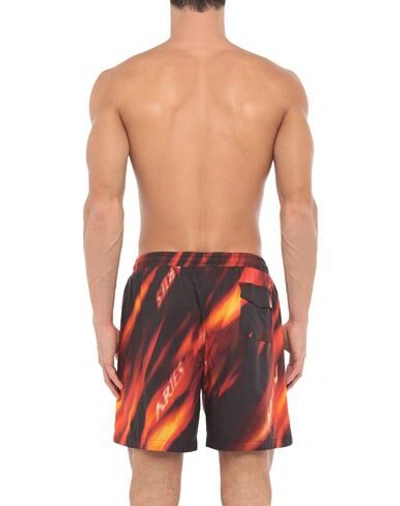 Shop Aries Swim Trunks In Red