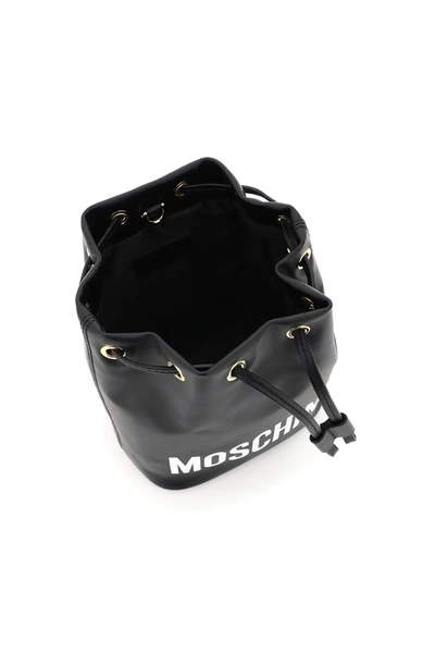 Shop Moschino Logo Bucket Bag In Black,white