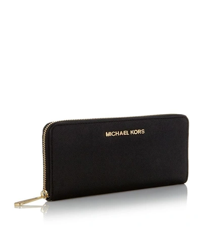 Shop Michael Michael Kors Jet Set Zip-around Wallet In Black