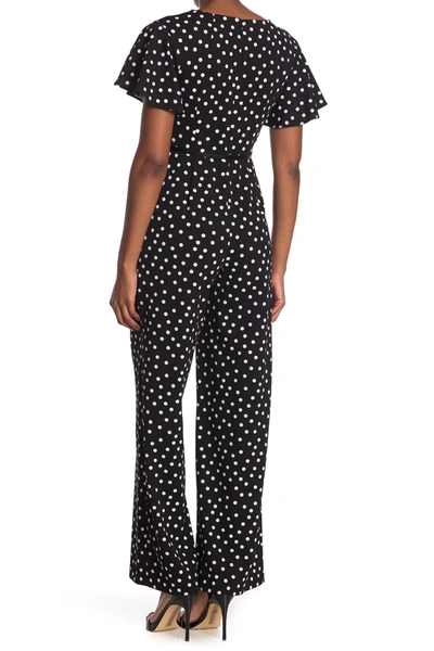 Shop Calvin Klein Flutter Short Sleeve Dash Print Jumpsuit In Blk Wht