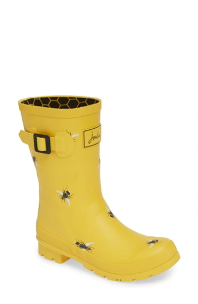 Shop Joules Molly Mid Height Printed Welly Rain Boot In Gldbotb