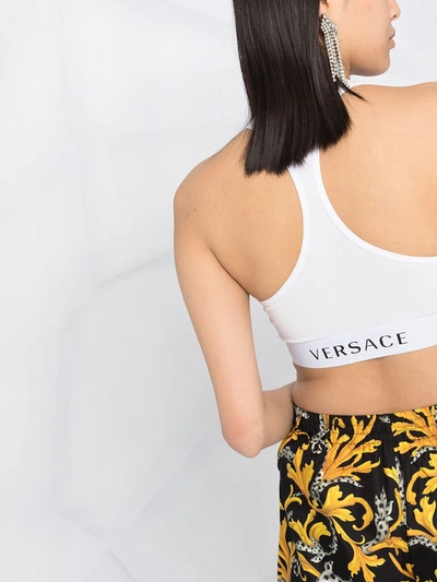 Shop Versace Logo Band Sports Bra In White