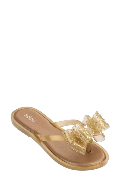 Shop Melissa Bubblegum Scent Bow Flip Flop In Wht Gold