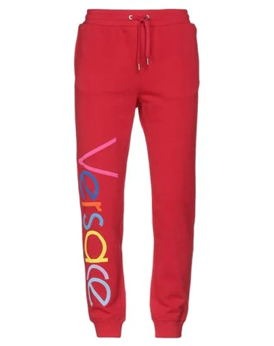 Shop Versace Pants In Red
