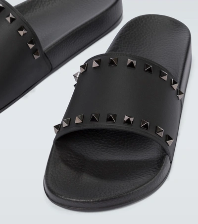 Shop Valentino Rockstud Slides In Black