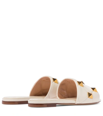 Shop Valentino Roman Stud Leather Slides In White