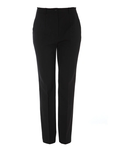 Shop Dolce & Gabbana Stretch Wool Carrot Fit Trousers In Black