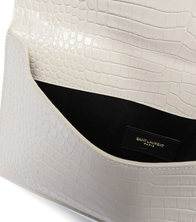 Shop Saint Laurent Uptown Croc-effect Leather Clutch In White