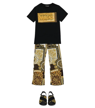 Shop Versace Barocco Patchwork Flared Pants In Gold