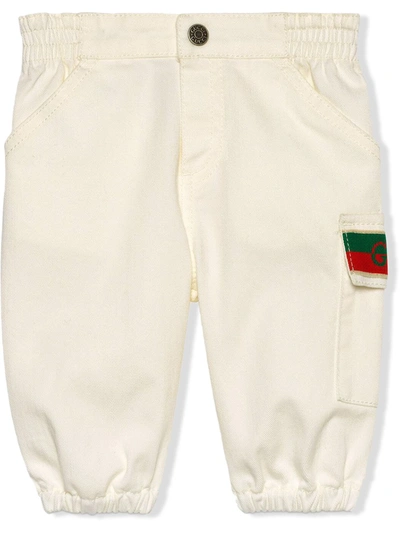 Shop Gucci Jacquard Knit-logo Jeans In White