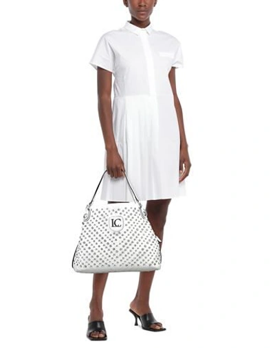 Shop La Carrie Handbags In White