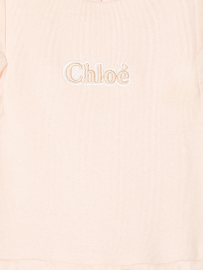 Shop Chloé Embroidered-logo Ruffled Jumpsuit In Pink