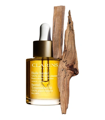 Shop Clarins Santal Treatment Oil In Yellow